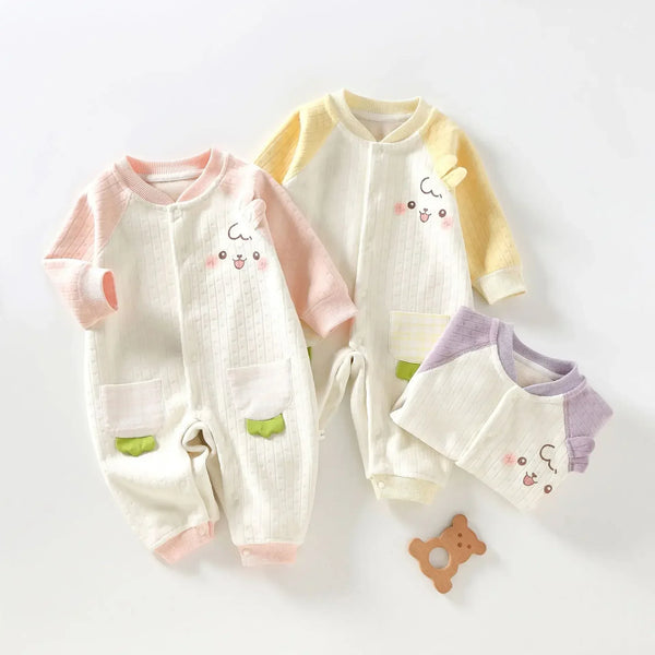 Soft cotton baby romper with animal face print in white with pink, yellow, and purple sleeves
