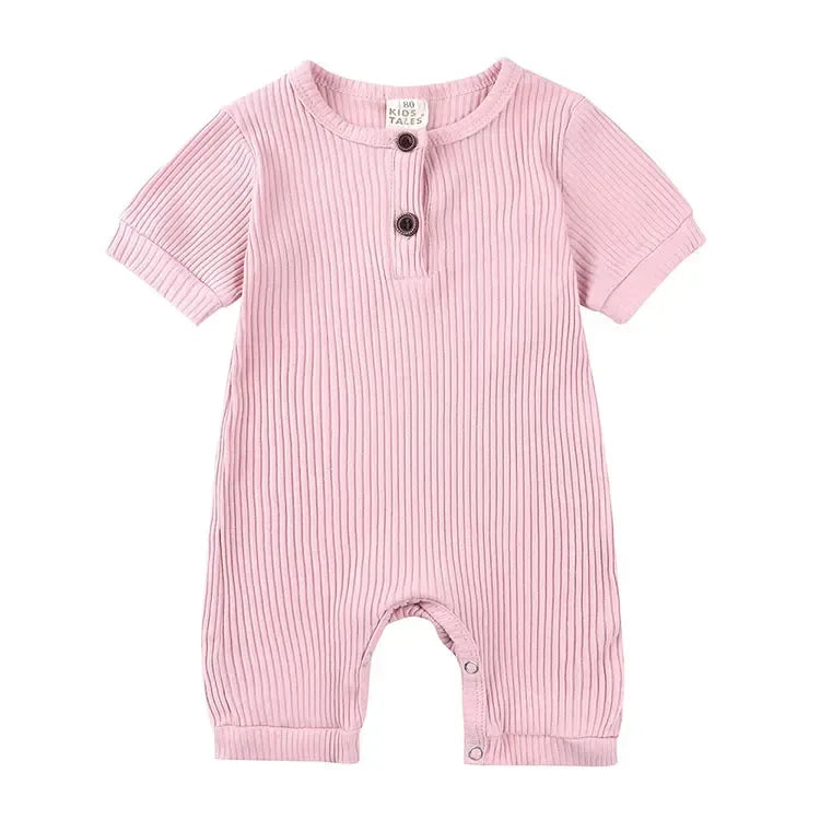 pink ribbed baby romper with short sleeves and button details for infants