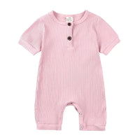 pink ribbed baby romper with short sleeves and button details for infants