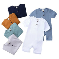 Baby romper set with short sleeves in white, blue, navy, mustard, teal, and gray ribbed fabric