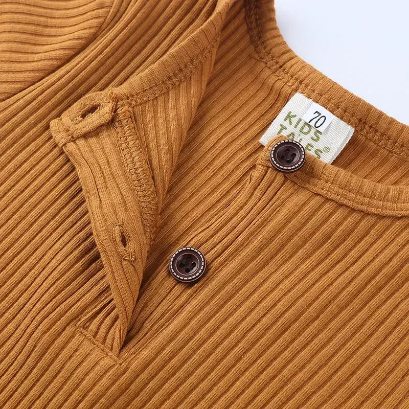brown ribbed baby romper for 3-6 months with button closure on front neckline