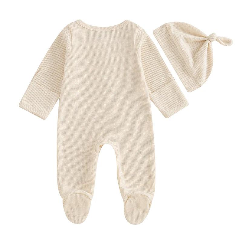 Cream baby romper set with hat, newborn size, waffle knit fabric with footed legs and knotted hat