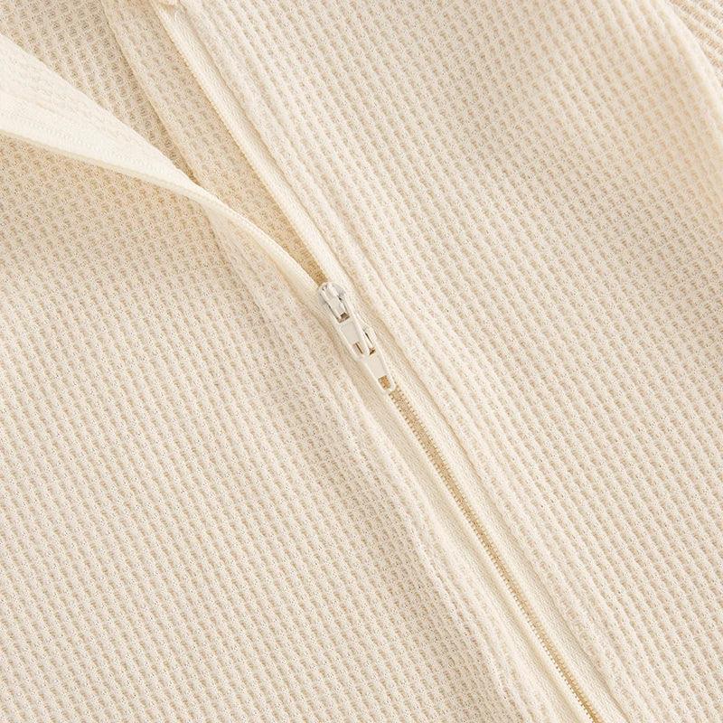 cream baby romper set with hat in waffle knit fabric, newborn size zipper detail
