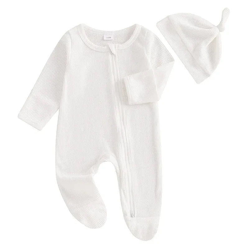 White baby romper set with hat in soft ribbed fabric, newborn size with long sleeves and footed legs