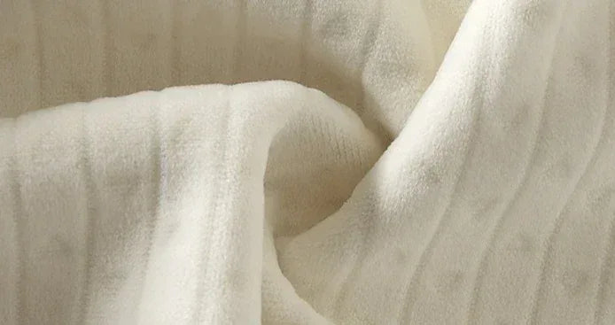 Soft white cotton fabric close-up for baby romper with gentle texture
