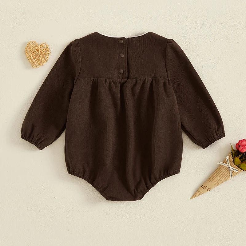baby romper with oversized bow in dark brown, long sleeve for infants with back button closure