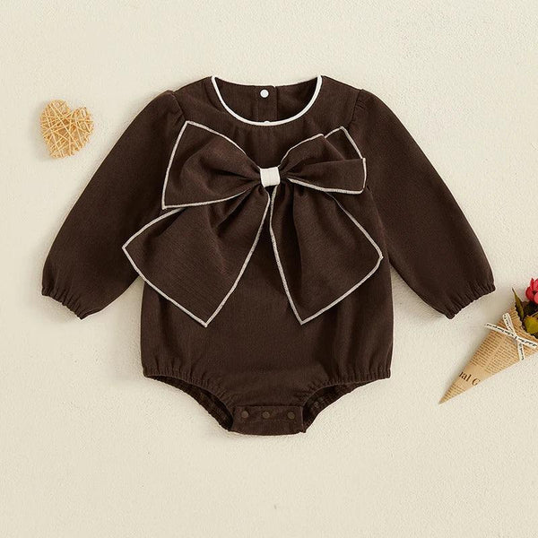 brown baby romper with oversized bow and long sleeves for infants