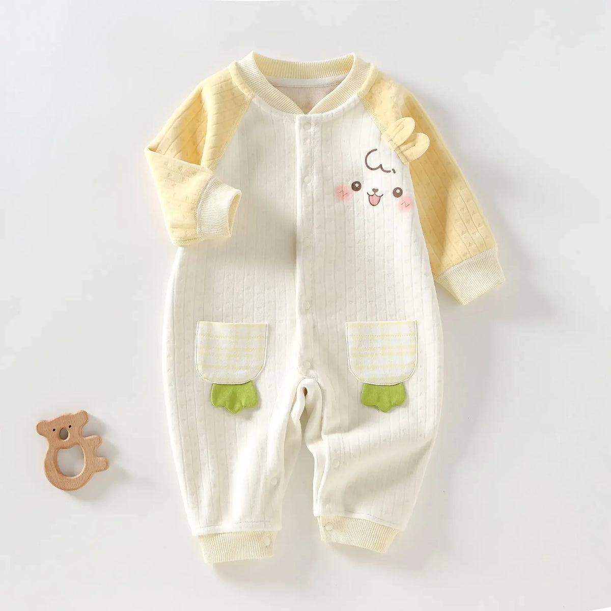 Yellow and white cotton baby romper with long sleeves and cute animal face design