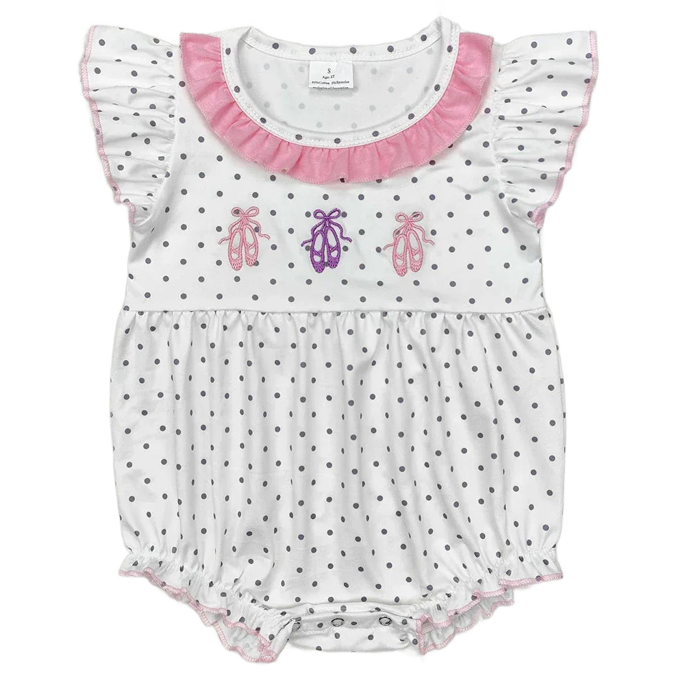 White baby rompers with gray polka dots, pink ruffle collar, flutter sleeves, and ballet shoe embroidery for infants