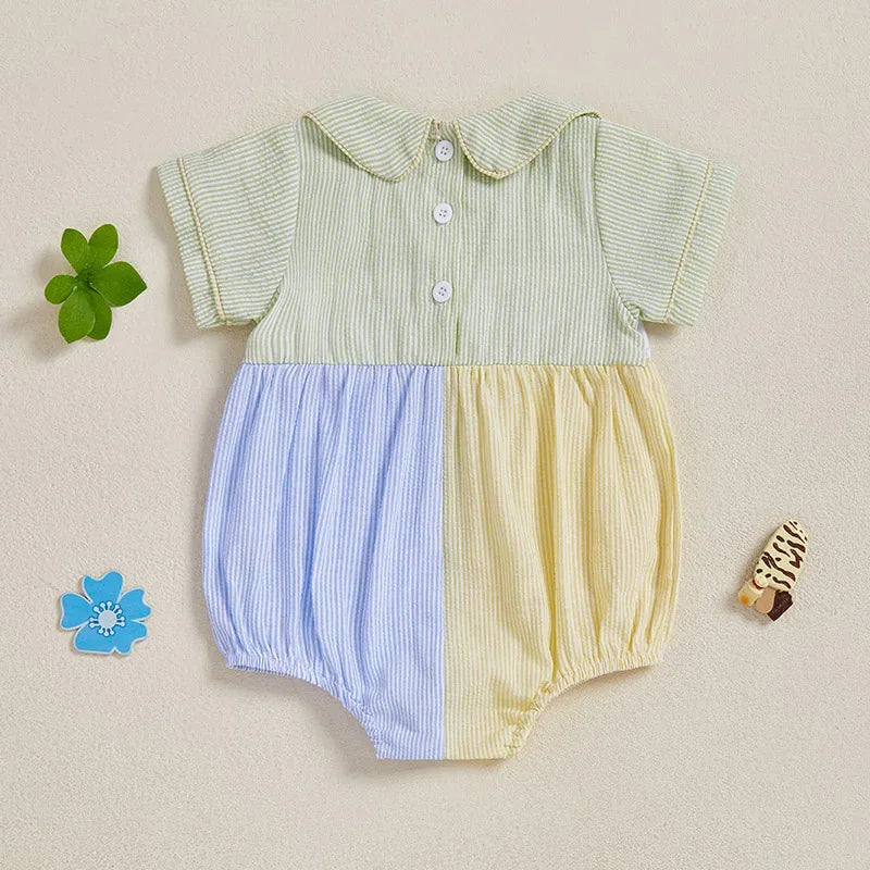 Baby seersucker romper with sailboat embroidery, Peter Pan collar, pastel blue and yellow panels.