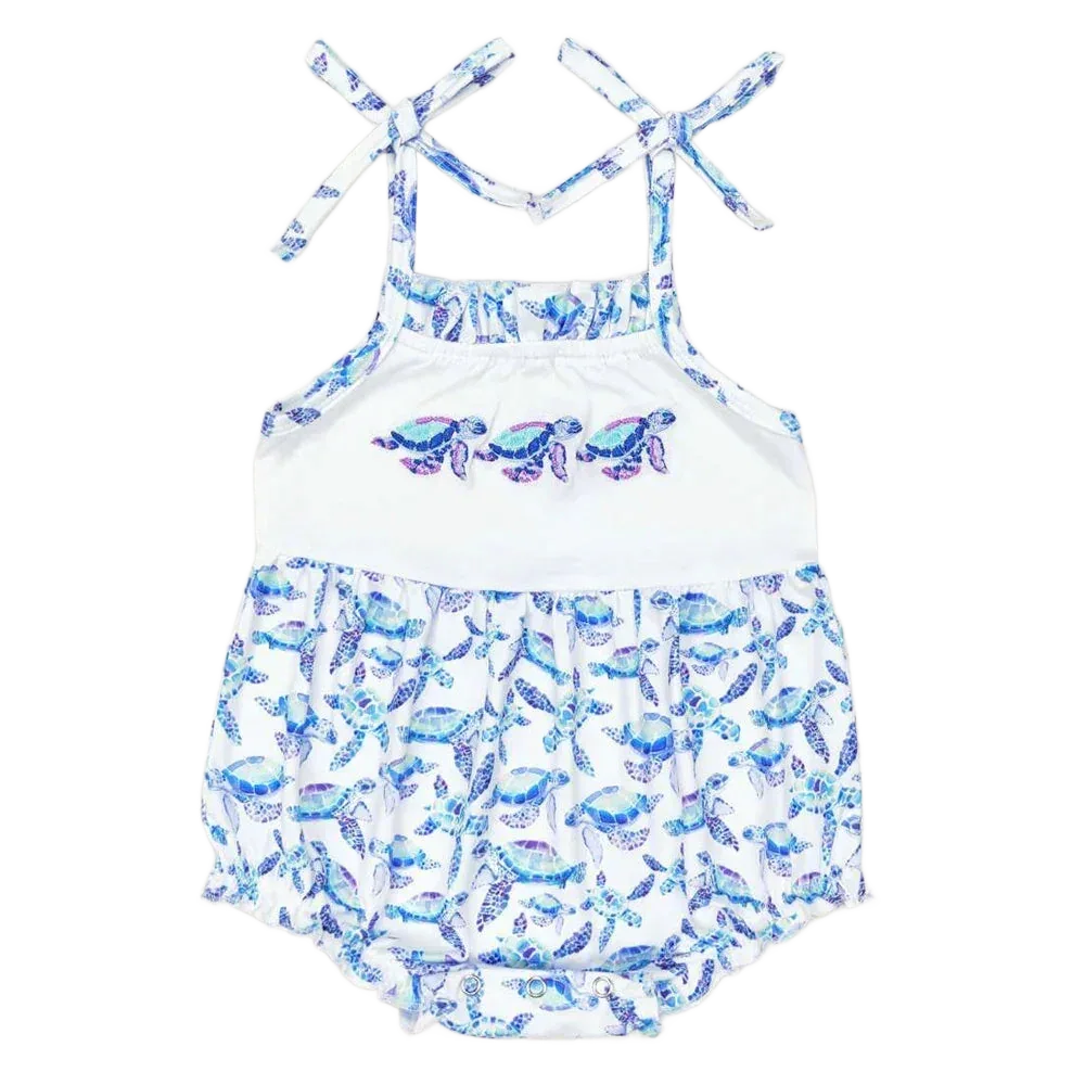 White and blue baby sunsuit with turtle print and tie shoulder straps for infants