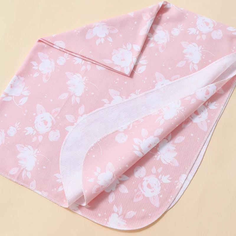 pink floral swaddle wrap for babies with white flower print and soft fabric
