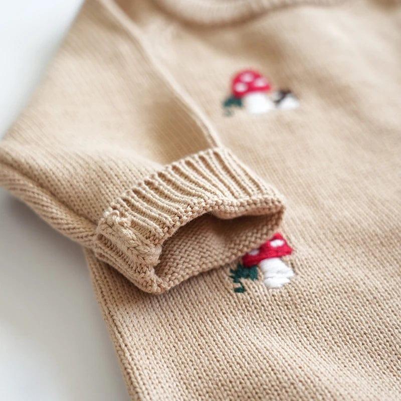beige baby winter romper with long sleeves and red mushroom embroidery for infants