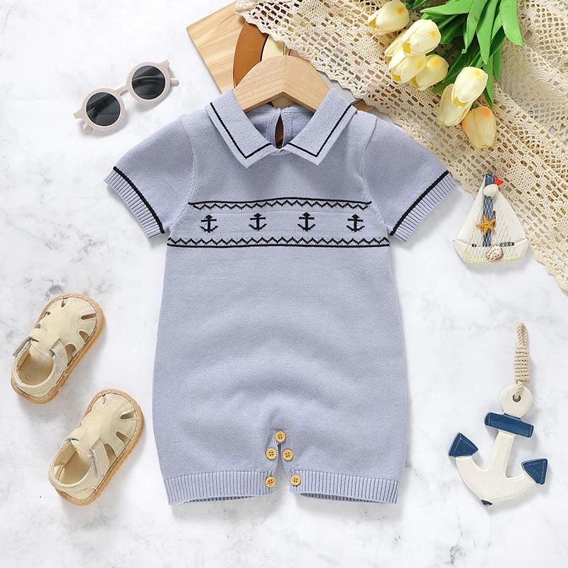 Light blue nautical baby romper for babies with anchor design and short sleeves