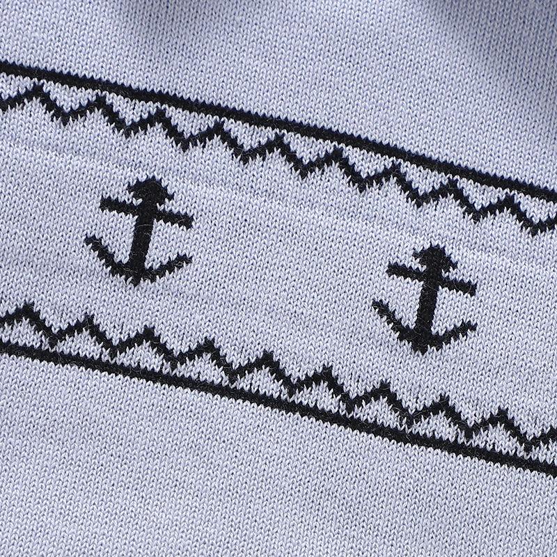 Light blue nautical baby romper for infants with black anchor pattern detail