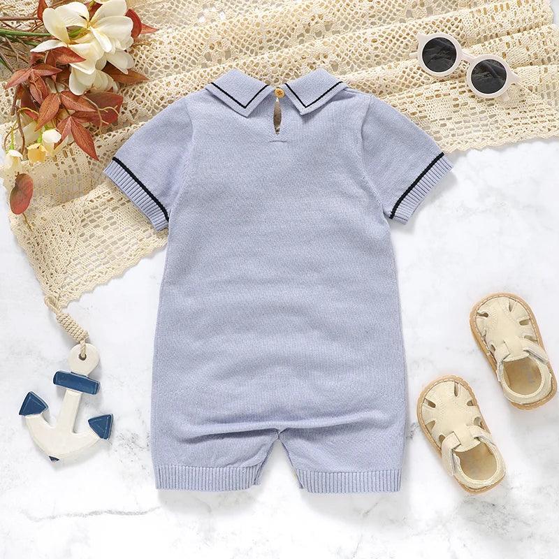 Light blue nautical baby romper for infants with short sleeves and sailor collar detail