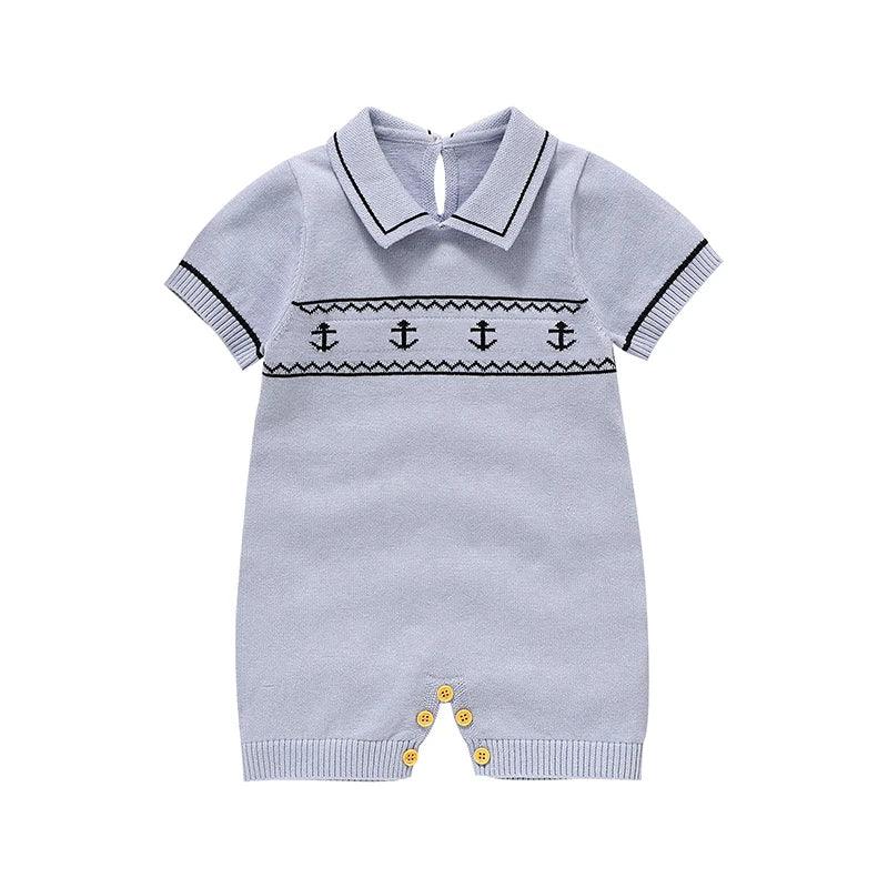 Light blue nautical baby romper for infants with black anchor design and short sleeves