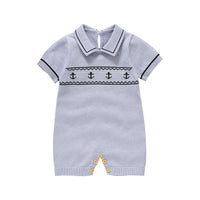 Light blue nautical baby romper for infants with black anchor design and short sleeves