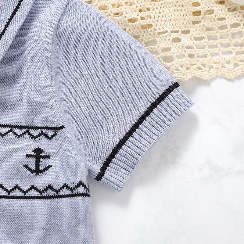 Light blue nautical baby romper for infants with black anchor and short sleeves