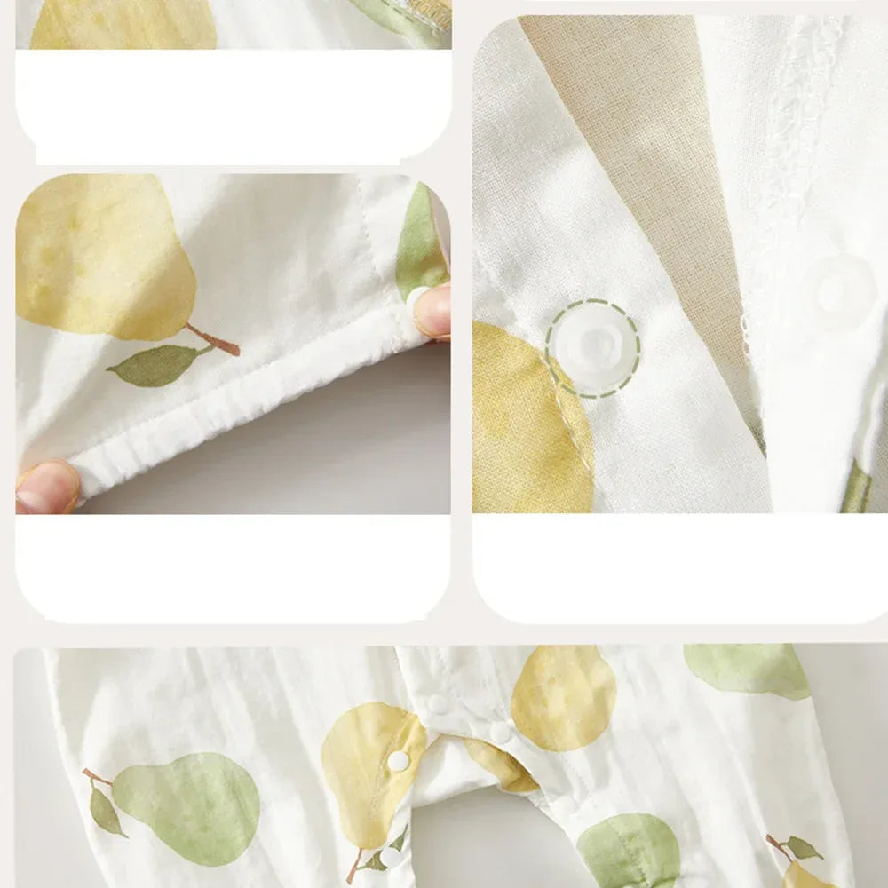 White cotton fruit print baby romper with yellow and green pear design and snap closures