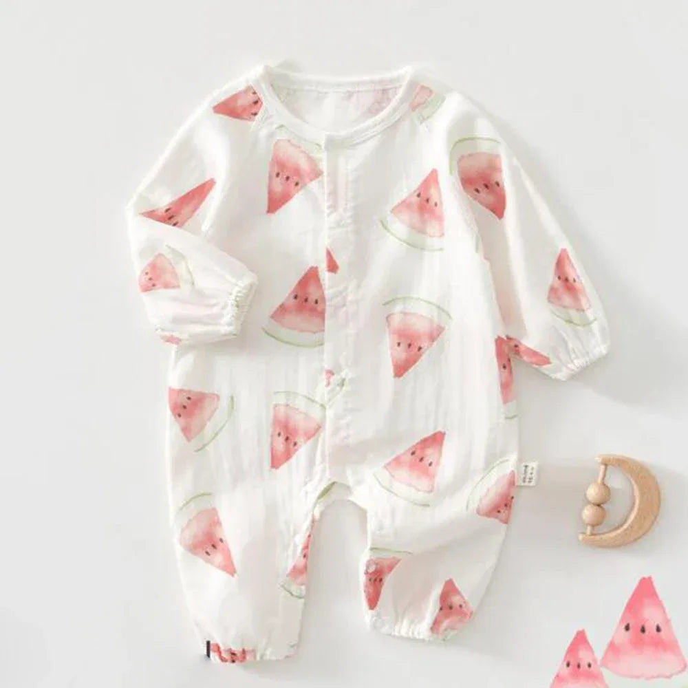 White cotton fruit print baby romper with pink watermelon slices long sleeves and elastic cuffs