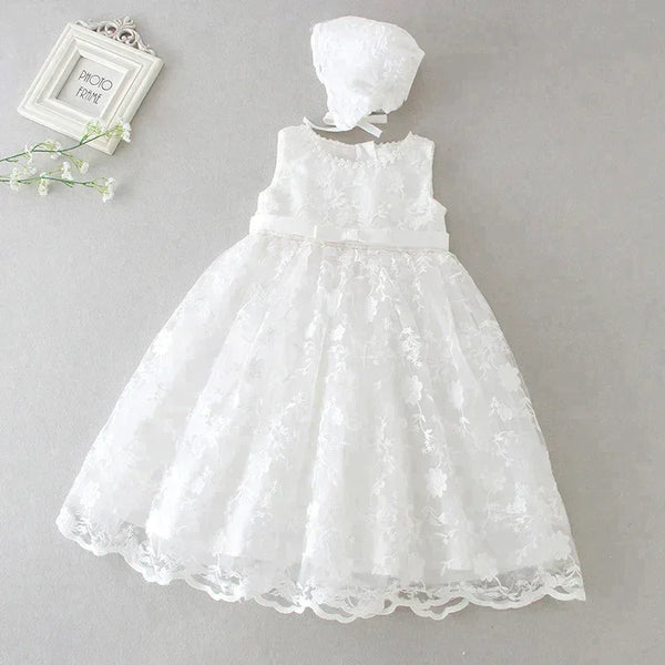 White baptism dress for baby girl with floral lace overlay and matching bonnet