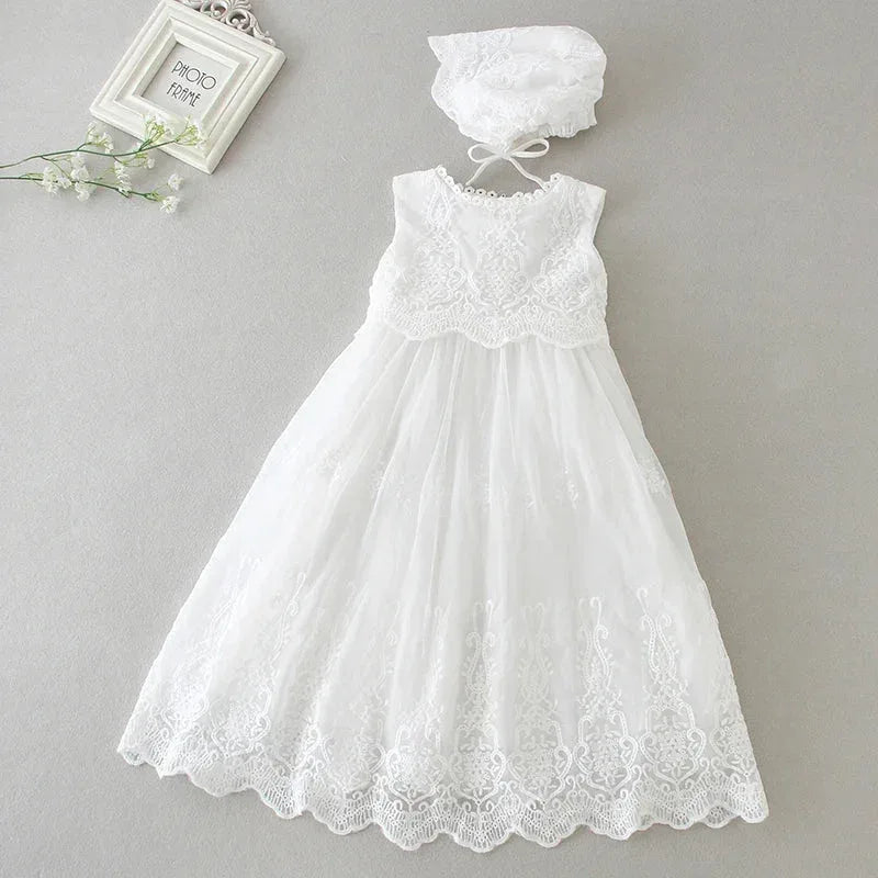 white baptism dress for baby girl with lace bodice and scalloped hem, includes matching bonnet