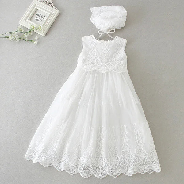white baptism dress for baby girl with lace bodice and scalloped hem, includes matching bonnet