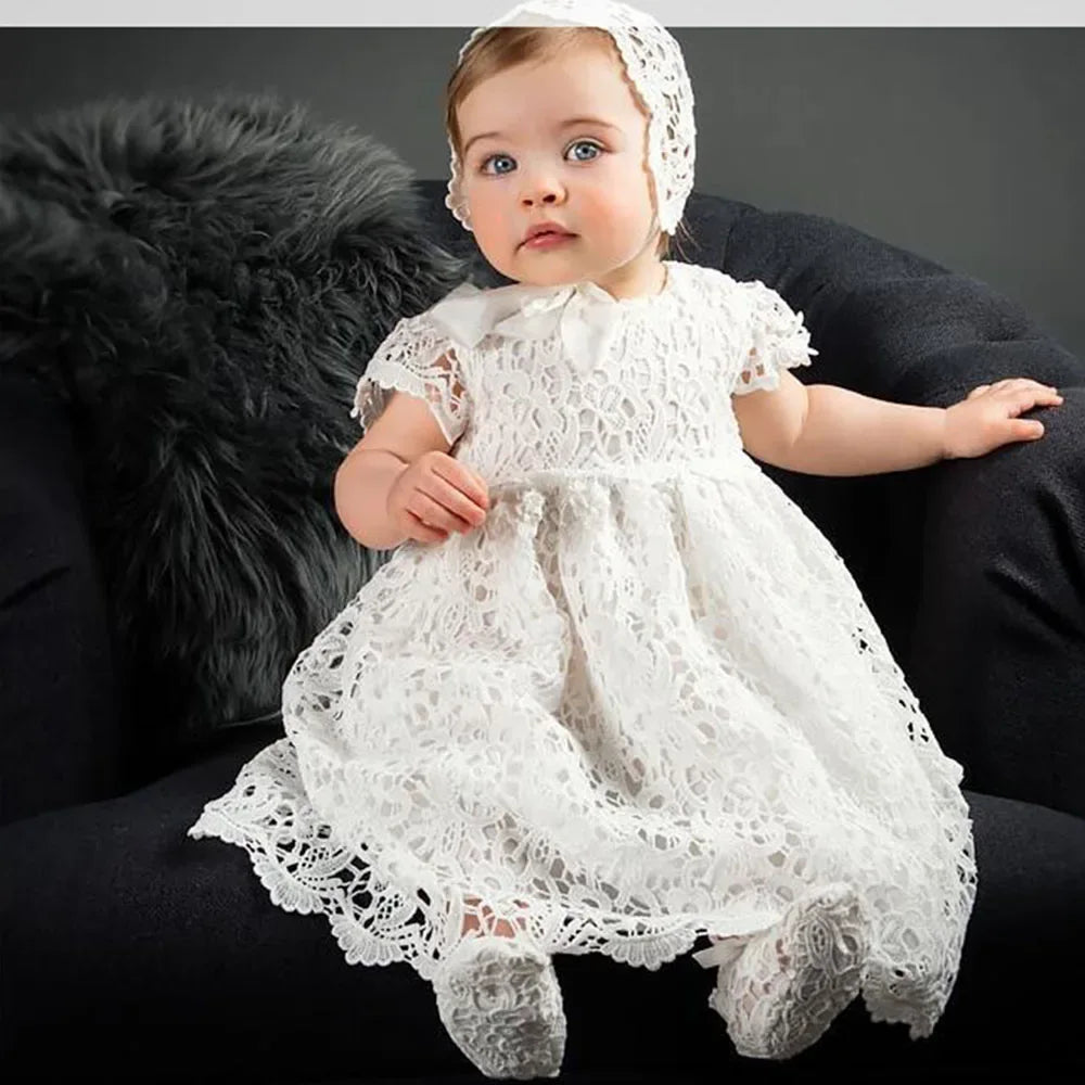 white lace baptism gown for baby girl with matching bonnet and booties, delicate floral design