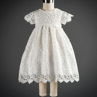 White lace baptism gown for babies with short sleeves and scalloped hem detail