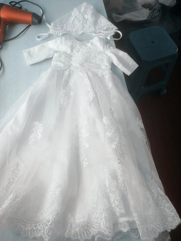 White baptism long gown for babies with lace detailing and matching bonnet