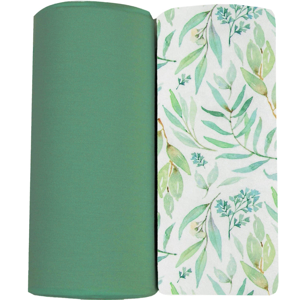 Basil & Sage 2 Pack Swaddle Blanket featuring a soothing green solid color and a stylish leafy design, perfect for newborn comfort and nursery decor.