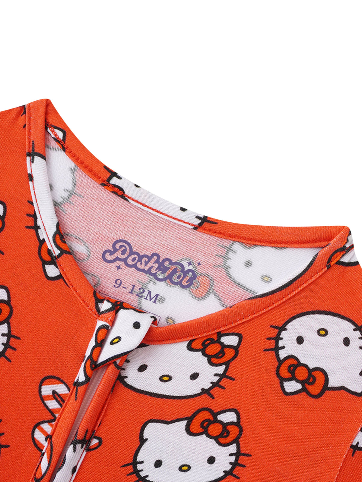 Close-up of purple PoshTOT logo on inner neck tape of orange infant pajamas with ribbed collar trim.