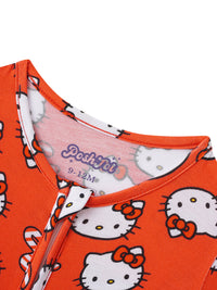 Close-up of purple PoshTOT logo on inner neck tape of orange infant pajamas with ribbed collar trim.