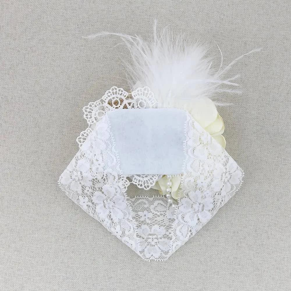 white beaded floral baby headband with lace, pearl beads, and feather detail for infants