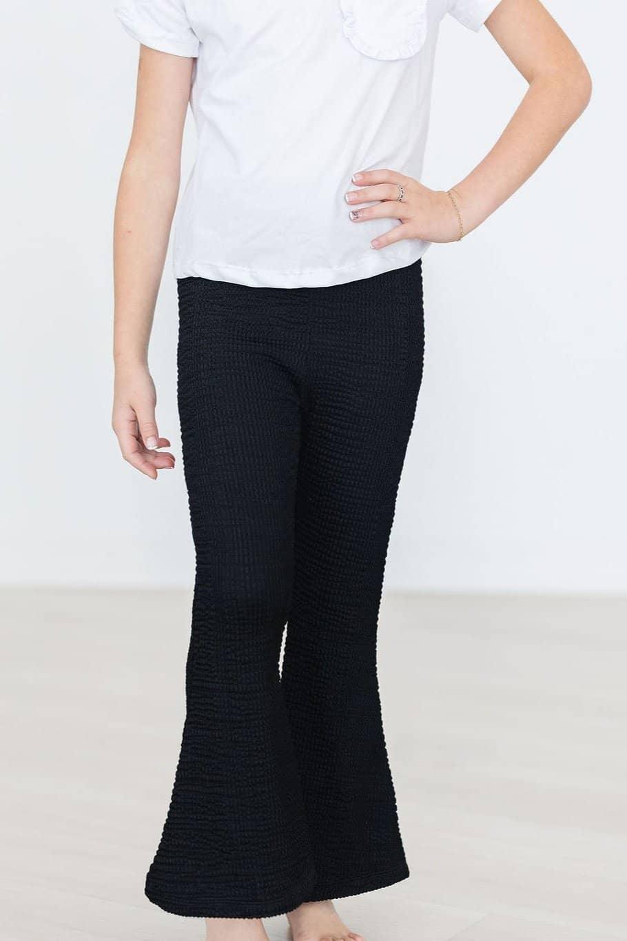 Girls black textured bell pants by Mila & Rose with flare fit and comfortable stretch fabric
