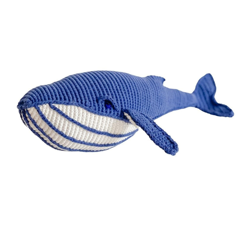 Hand-crocheted blue whale toy with organic cotton, featuring a deep blue body, white striped belly, and broad tail.