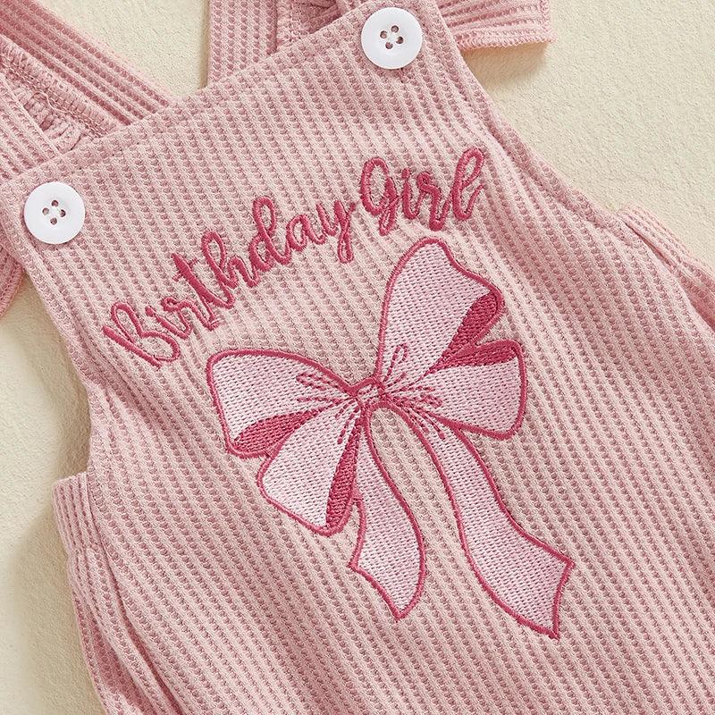 Pink baby girl birthday romper with embroidered bow and birthday girl text, sleeveless for infants