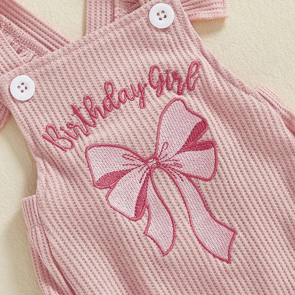 Pink baby girl birthday romper with embroidered bow and birthday girl text, sleeveless for infants