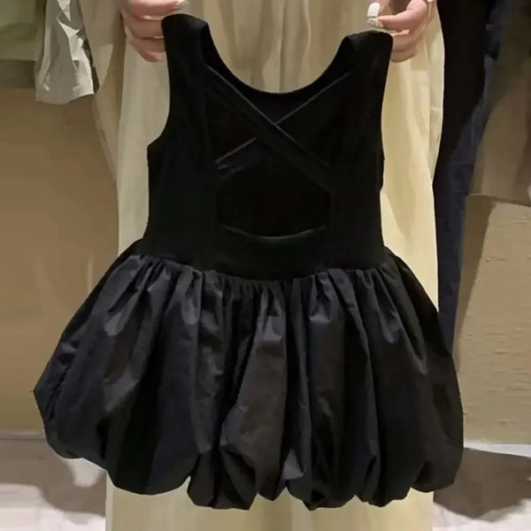 black girls party dress with cutouts in toddler size held up showing full front and skirt details