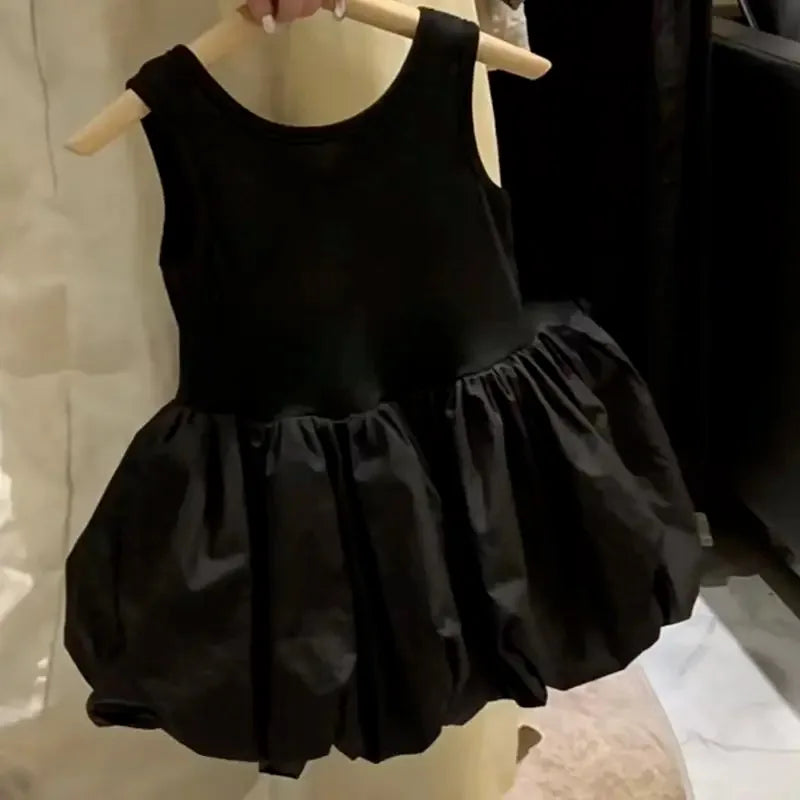 black girls party dress with cutouts hanging on wooden hanger for babies and kids