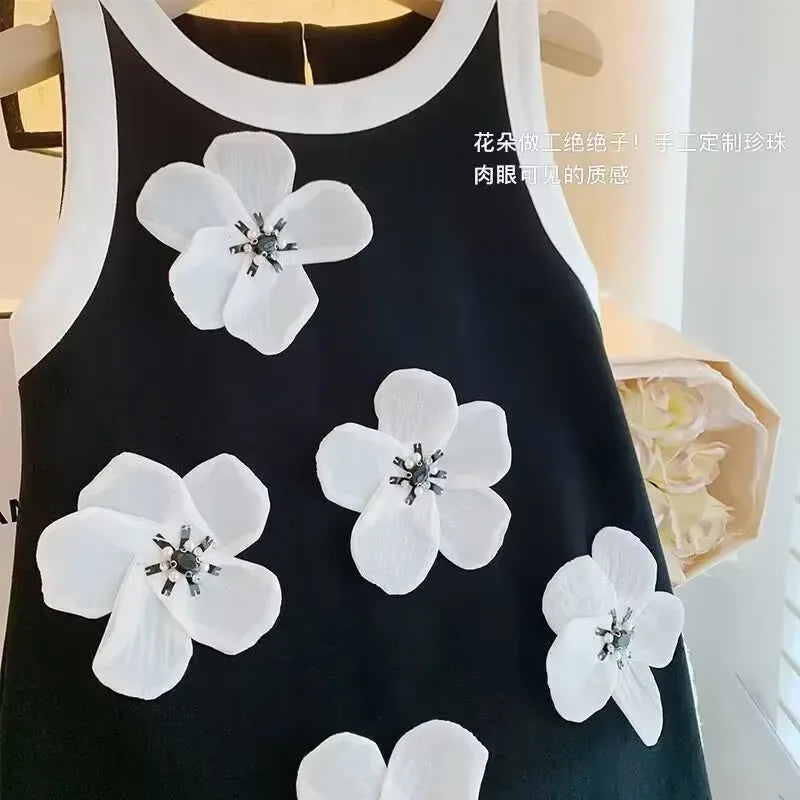 toddler black party dress with white trim and large white flower appliques for girls