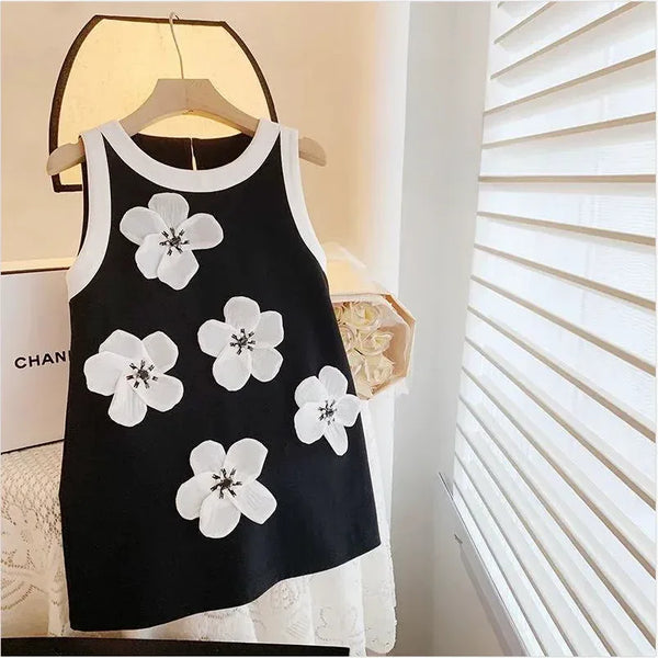 Black and white sleeveless party dress for girls with large white floral appliques