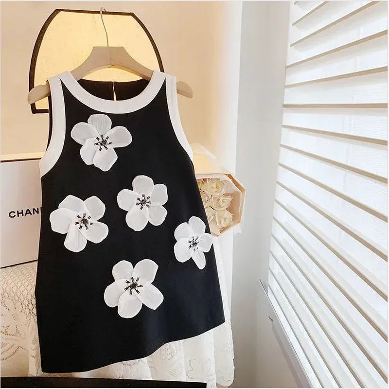 Black and white sleeveless party dress for girls with large white floral appliques