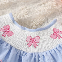 Blue embroidered baby bubble romper for infants with pink bow details on white smocked collar