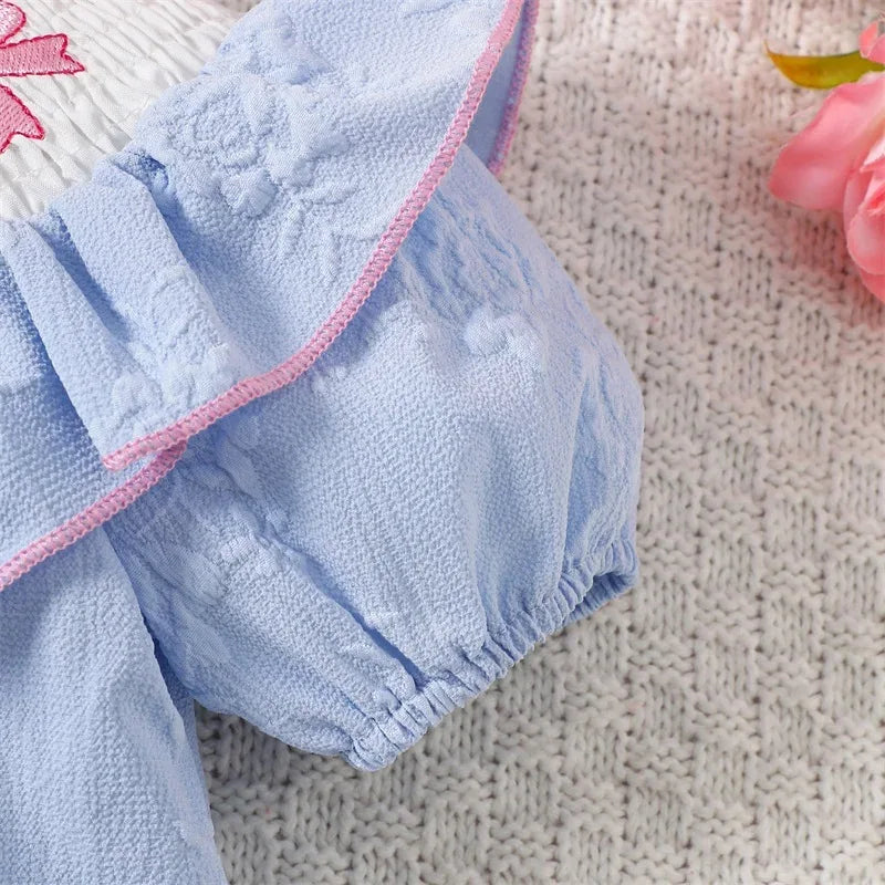 Blue embroidered baby bubble romper with pink trim, suitable for infants and toddlers