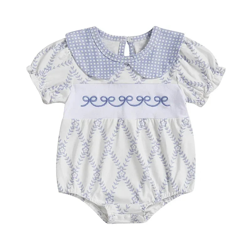 baby blue romper with puff sleeves and embroidered detail in size newborn to 12 months