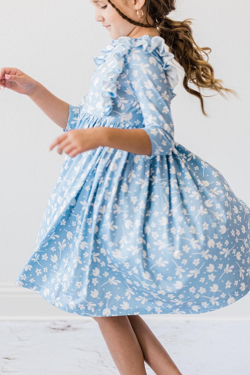 Girls blue ruffle twirl dress for girls with 3/4 sleeves floral pattern by Mila and Rose
