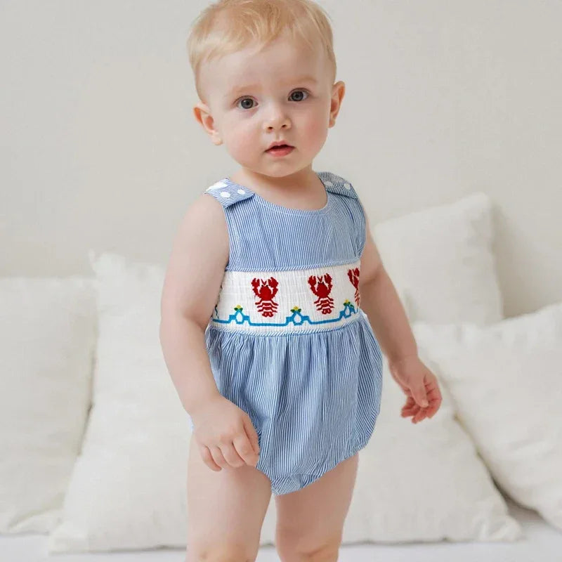 baby wearing blue seersucker romper baby with red lobster embroidery sleeveless