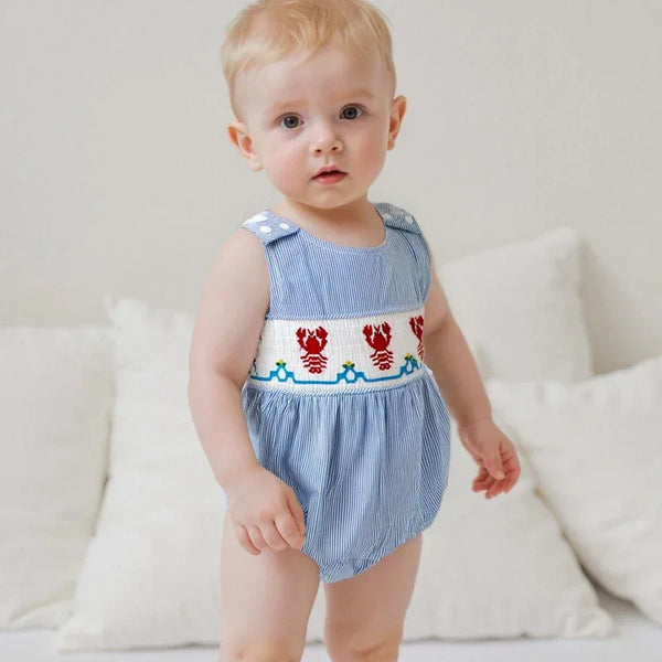 baby wearing blue seersucker romper baby with red lobster embroidery sleeveless